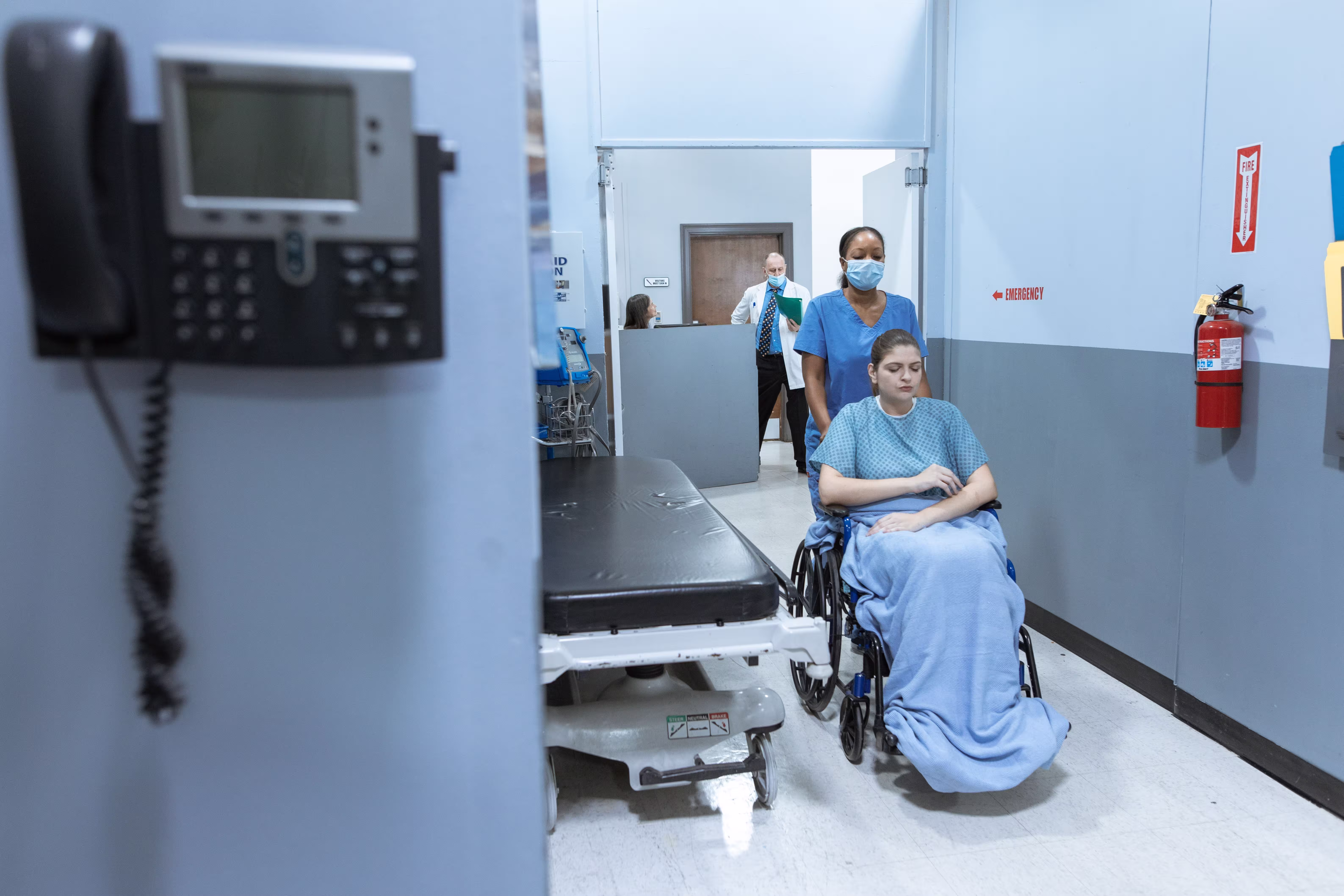 Nurse speaking warmly with a patient at Riverside General Hospital